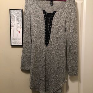 Long sleeved grey and black shirt.